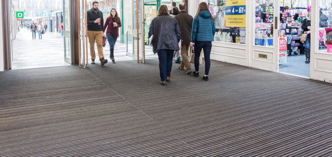 People walking across Entrance Matting at The Square