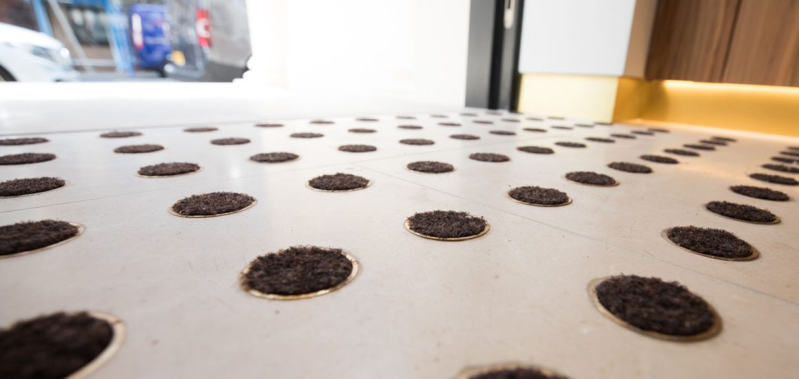 image showing circular object with fibre inserted to form the entrance matting at this commercial office building