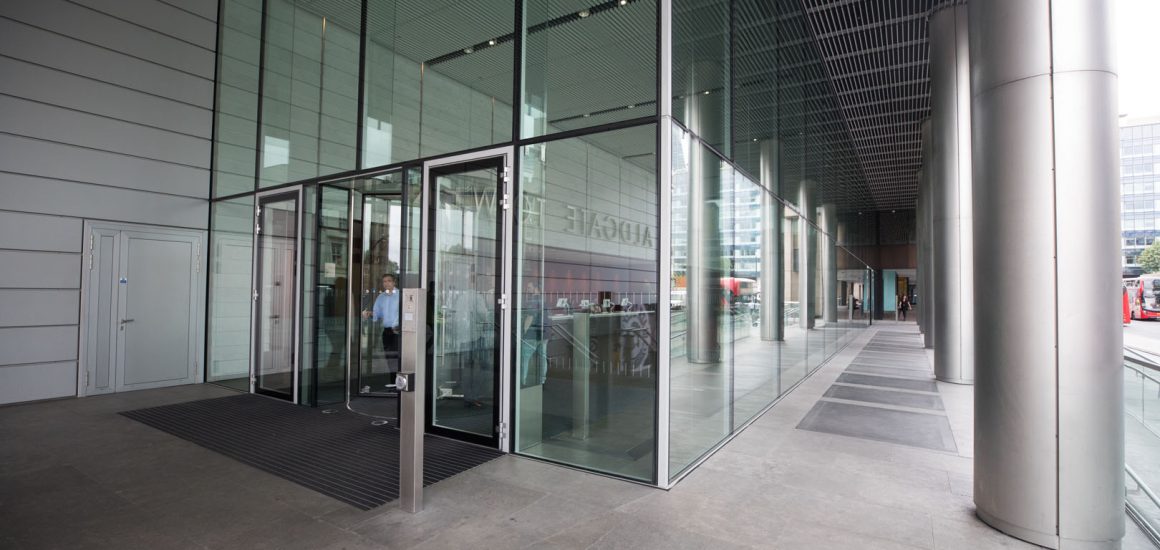 image showing the entrance of a commercial building with glass walls