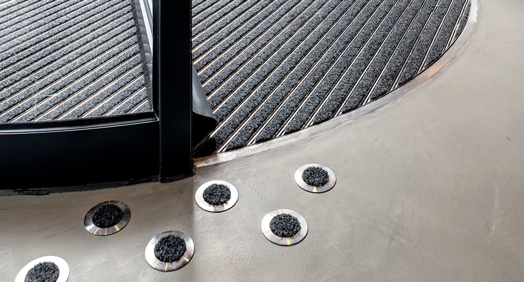 hotel entrance mat design combining complimentary stainless steel and grey polyamide fibre entrance matting systems