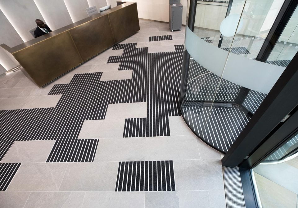 entrance matting angled in line with the buldign facade creates a clever yet functional design feature