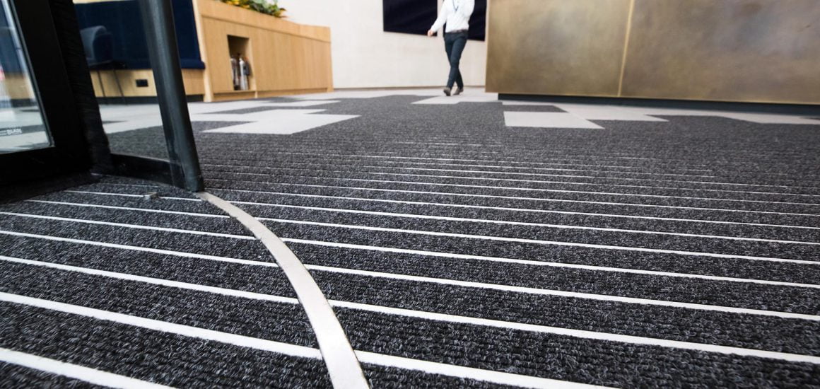 entrance matting with perfect rib alignment between revolving door and primary matting